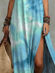 Close-up of the turquoise tie-dye fabric and side slit on the maxi dress.