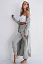 Side pose of model wearing gray open-front cardigan with matching lounge pants