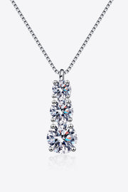 Silver necklace with three graduated crystal pendants shown on white