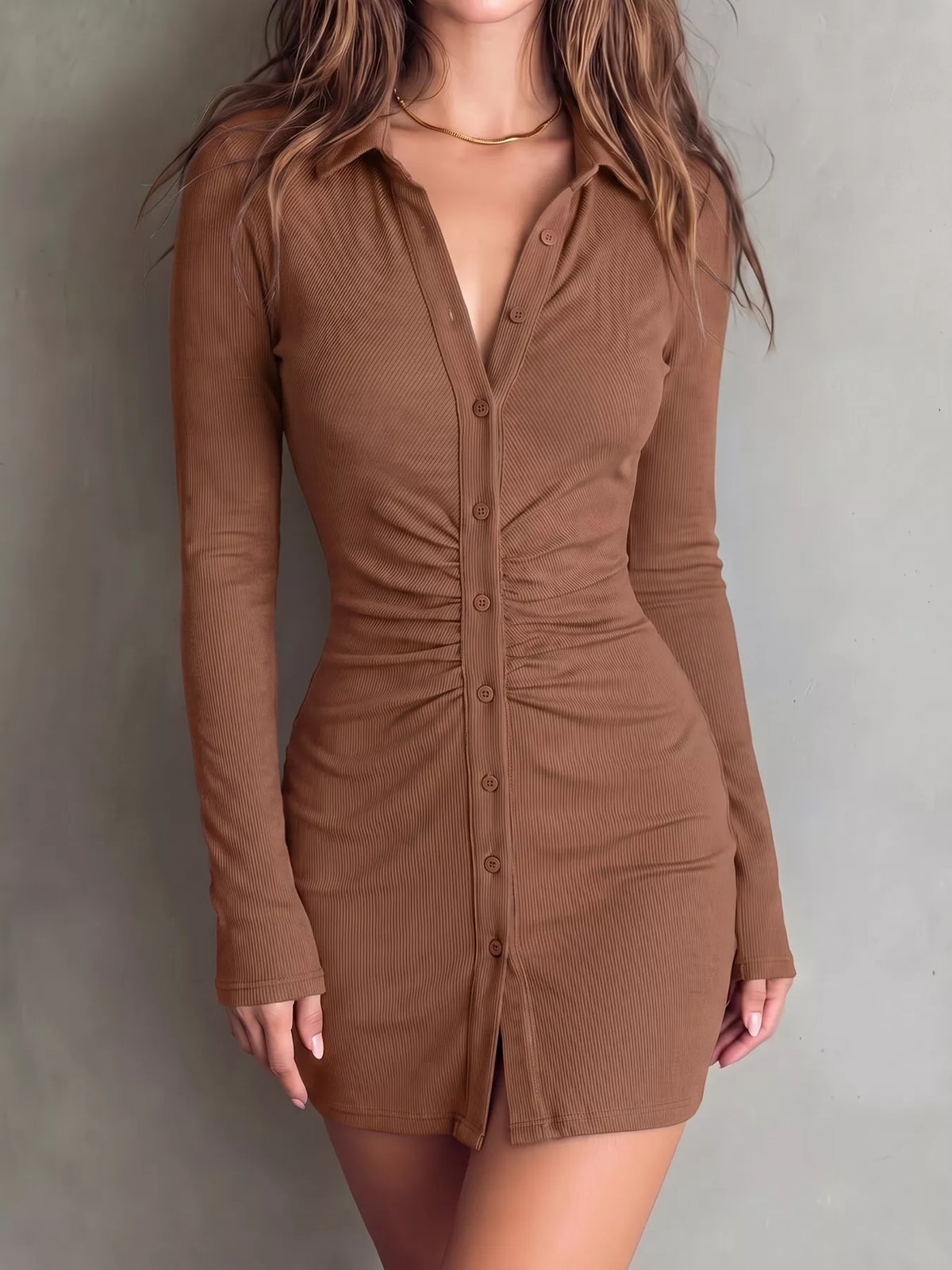 Front view of warm brown collared mini dress with long sleeves and front buttons.