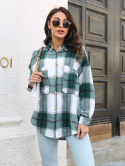 Plaid button-up collared shirt in green-and-white plaid front view holding lapel