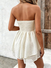 Back view showing smocked bodice and tiered skirt