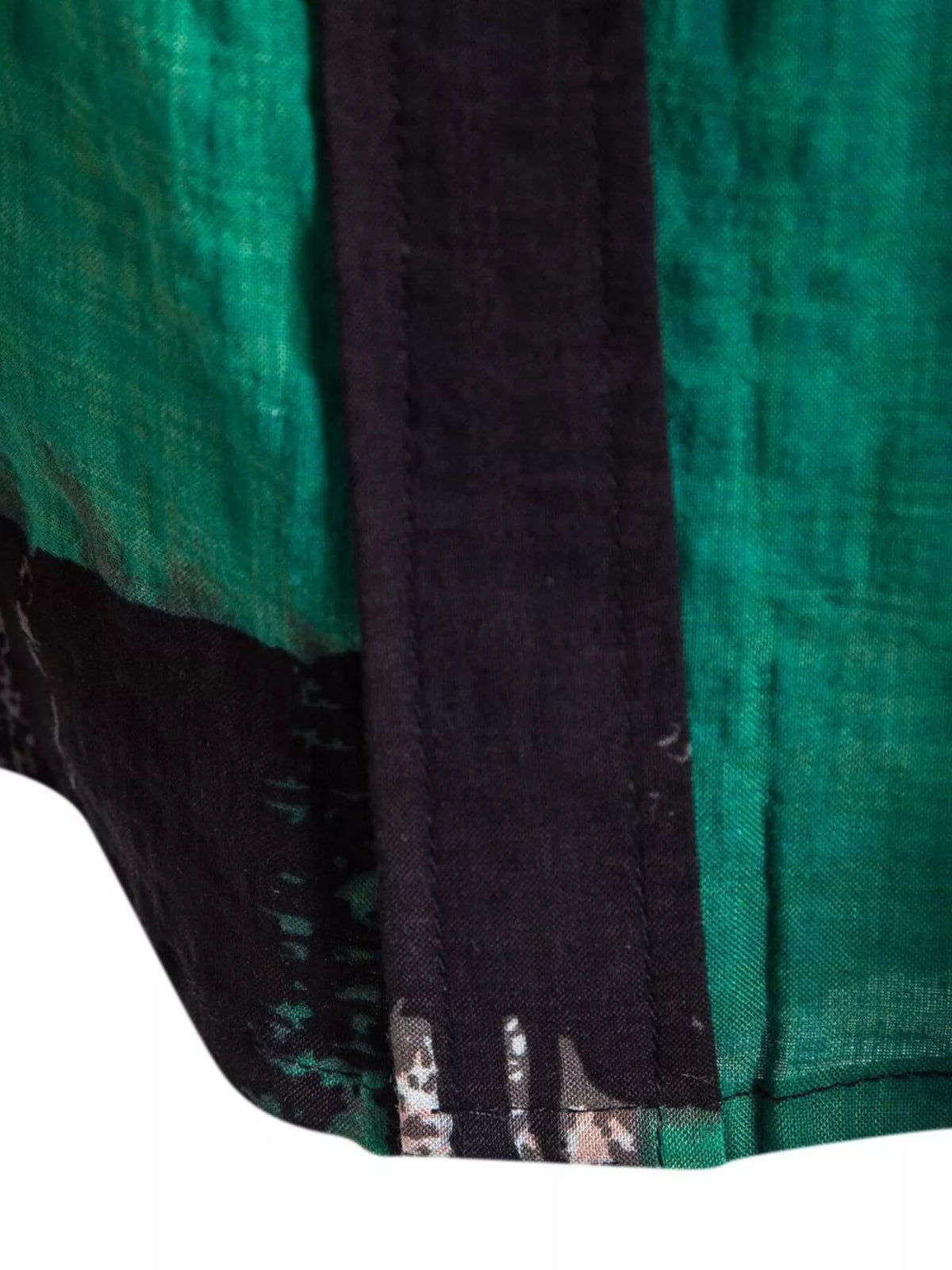Close-up of the green and black color blocks on the shirt