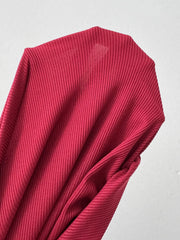 Close view of burgundy dress sleeve fabric and cuff