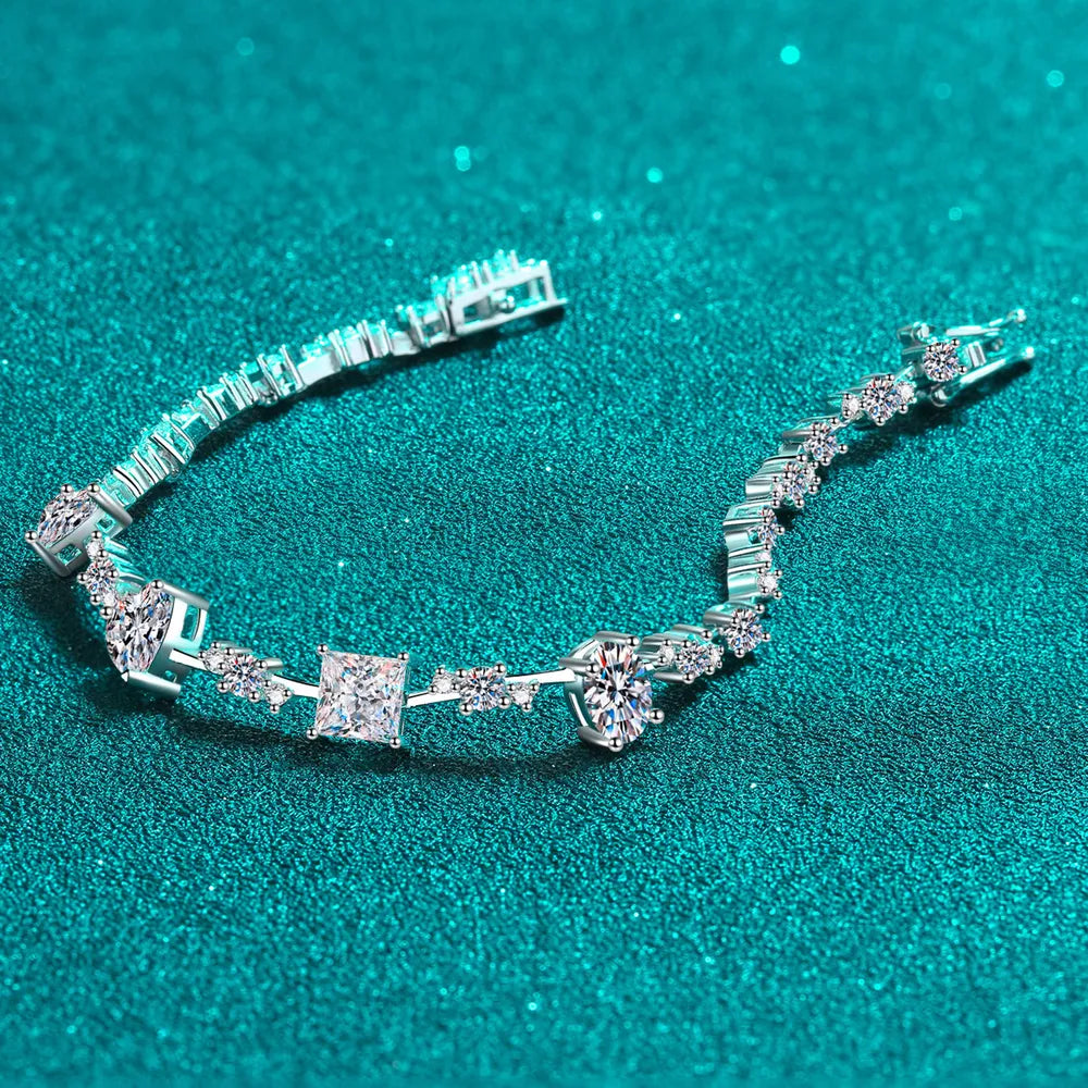 Silver moissanite bracelet laid open to show stone settings