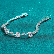 Silver moissanite bracelet laid open to show stone settings