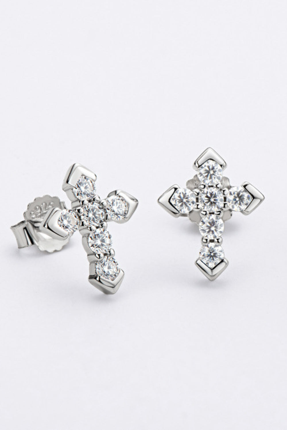 Silver-tone stone-set cross stud earrings shown from front and angled side