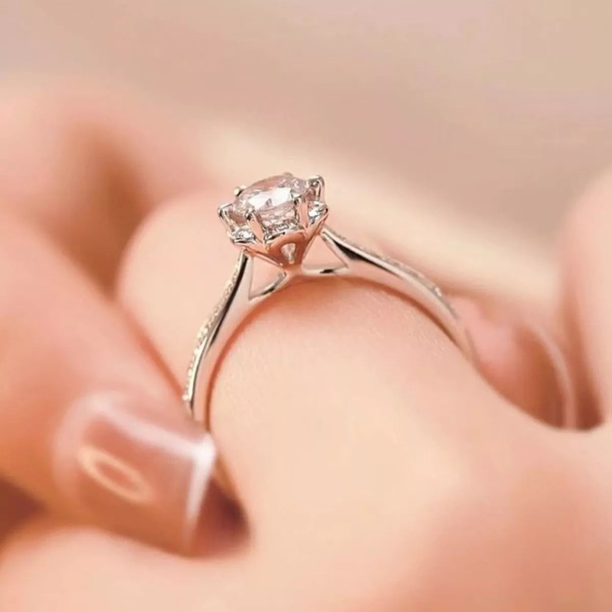 Side profile of moissanite ring showing raised setting and slim band