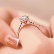 Side profile of moissanite ring showing raised setting and slim band
