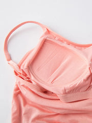 Inside view of blush dress showing built-in bra cups beneath the spaghetti straps