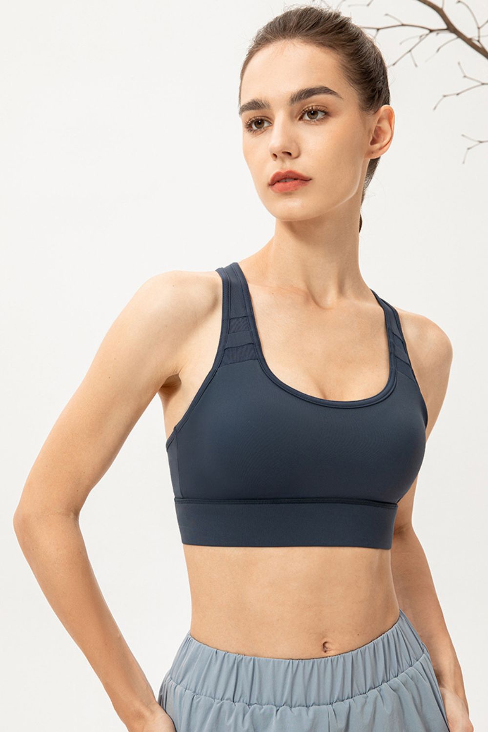 Navy scoop-neck sports bra shown from the front