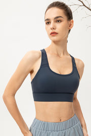 Navy scoop-neck sports bra shown from the front