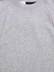 Gray T-shirt sleeve cuff with visible stitching