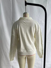 Cream ribbed polo sweater displayed on mannequin, back view
