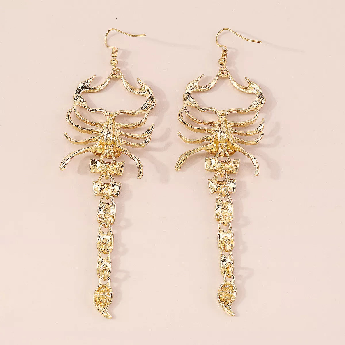 Pair of gold-tone scorpion dangle earrings shown upright