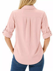 Back view of pink button-down shirt with rolled sleeves