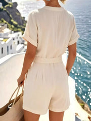 Back view of the white shirt and matching shorts set.