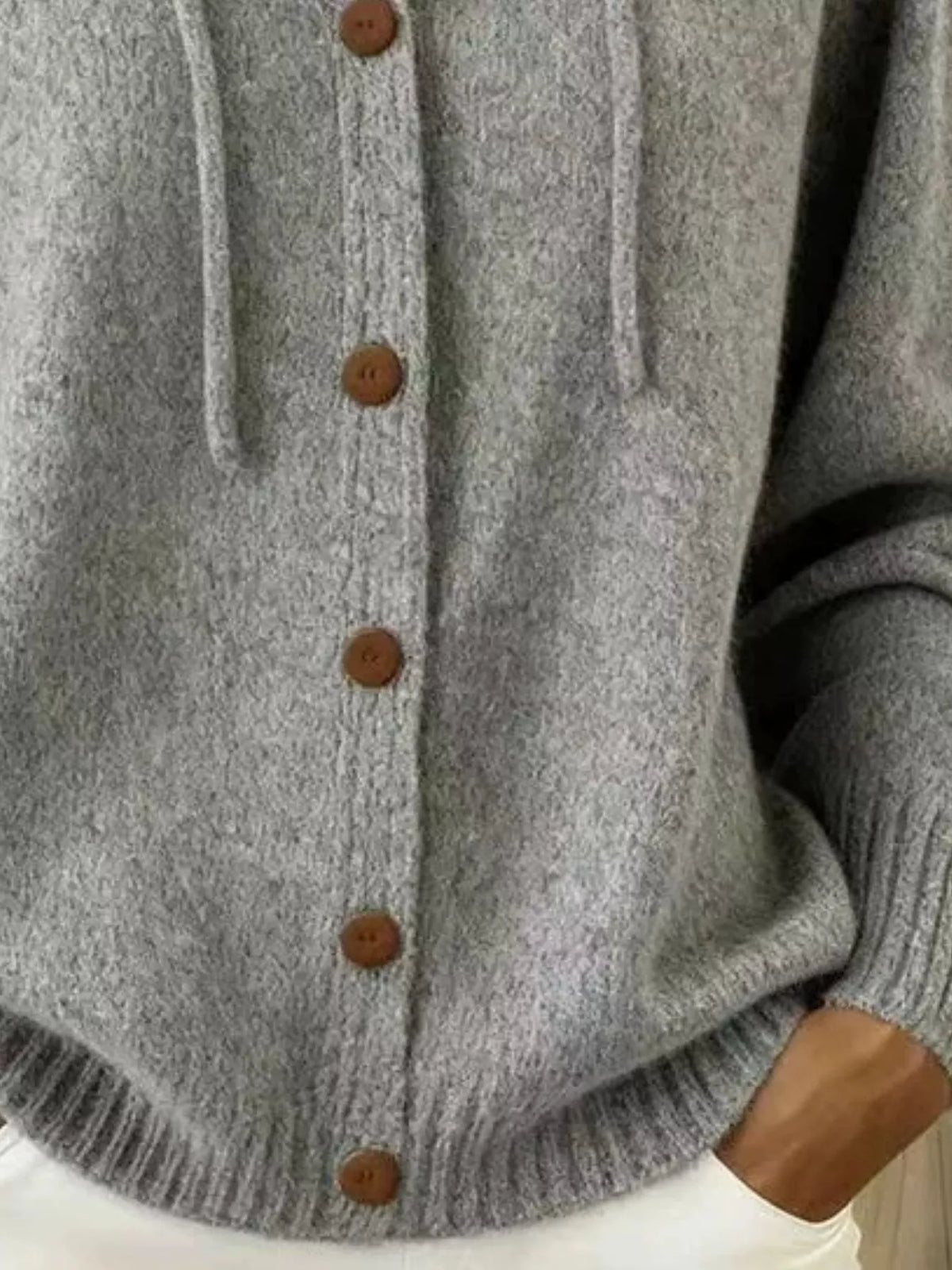 Detail of gray cardigan front and brown buttons