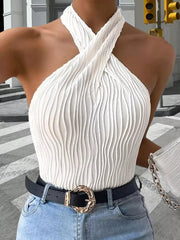 White ribbed halter tank showing crossed straps