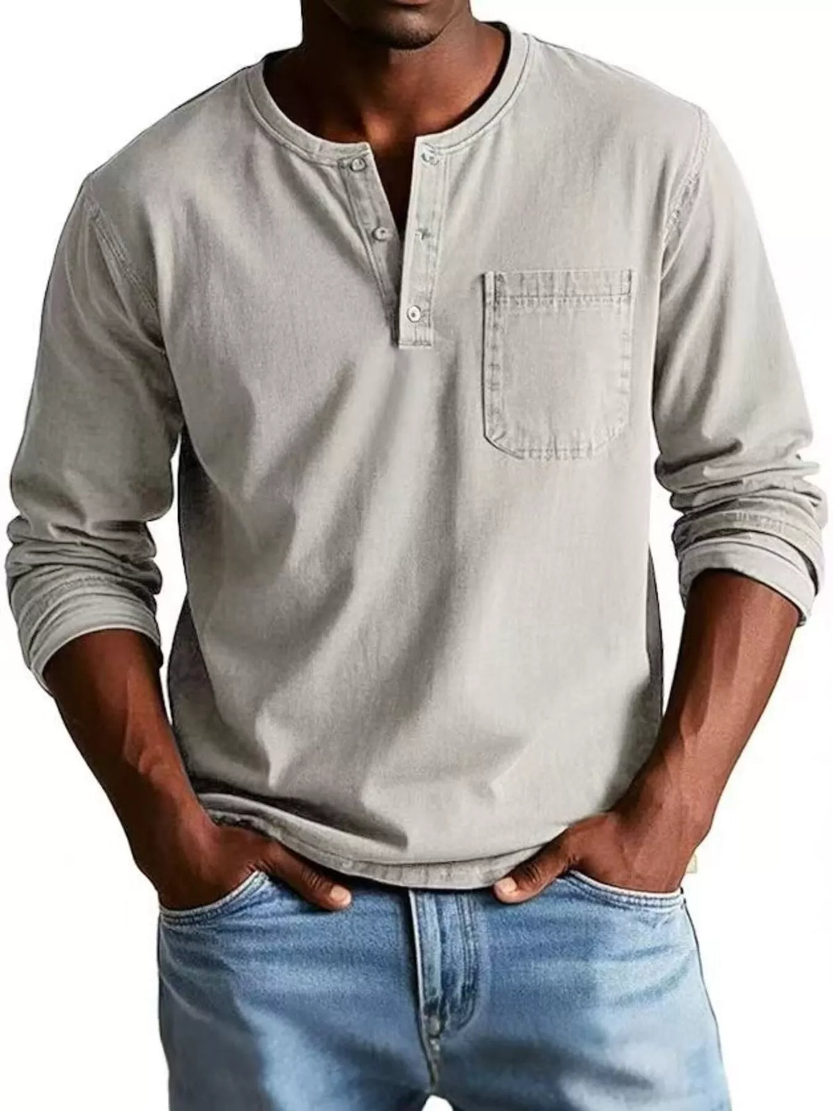 Close view of chest pocket and buttons on the long-sleeve top