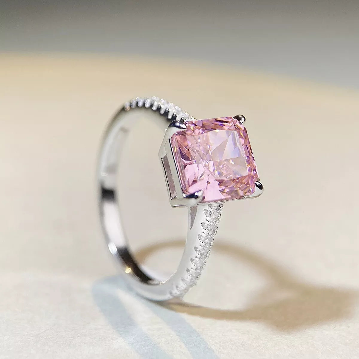 Angled view of pink square stone ring