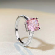Angled view of pink square stone ring