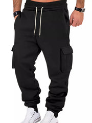 Model wearing black cargo joggers, front view