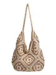Crochet shoulder bag with its long strap raised