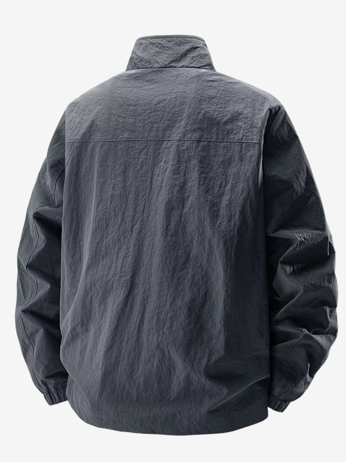 Rear view of charcoal jacket showing the shoulder yoke seam and gathered hem