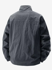 Rear view of charcoal jacket showing the shoulder yoke seam and gathered hem