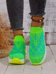 Front view of lime green and turquoise slip-on mesh trainers