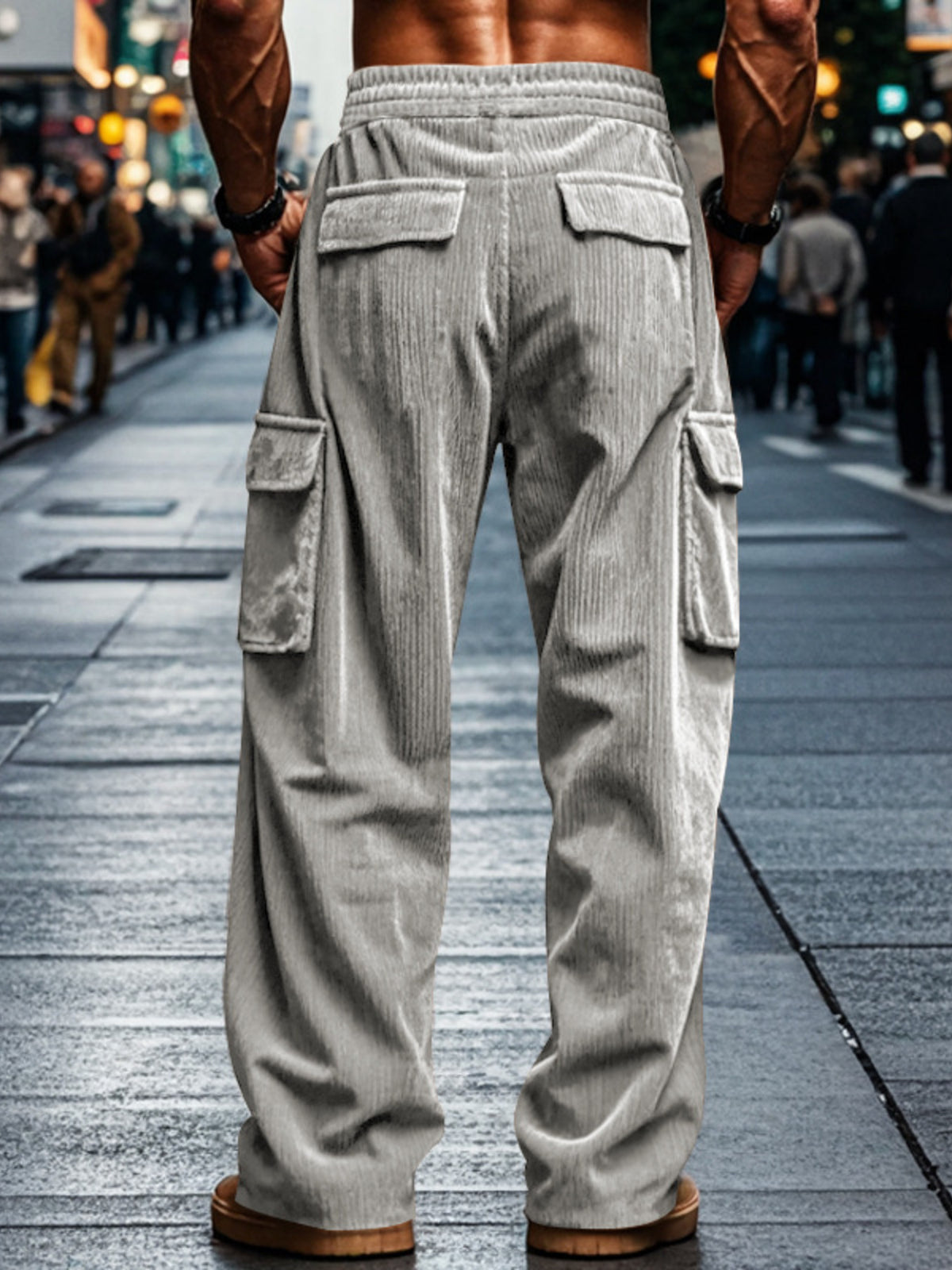Model wearing gray cargo pants with ribbed corduroy texture