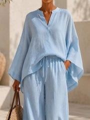 Closer view of the pale blue set showing the V-shaped notch and waist tie.