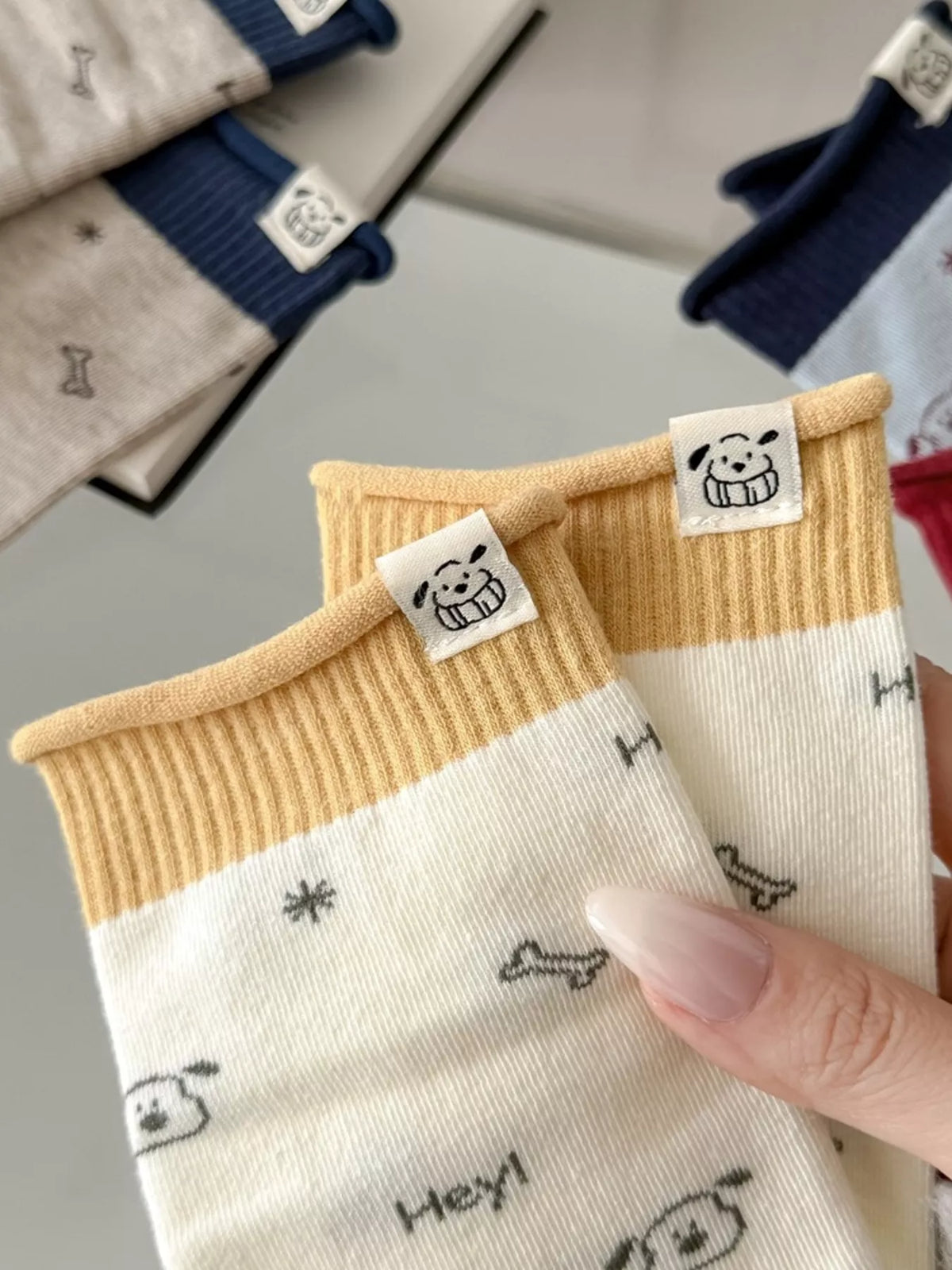 Close-up of cartoon motifs and ribbed cuff