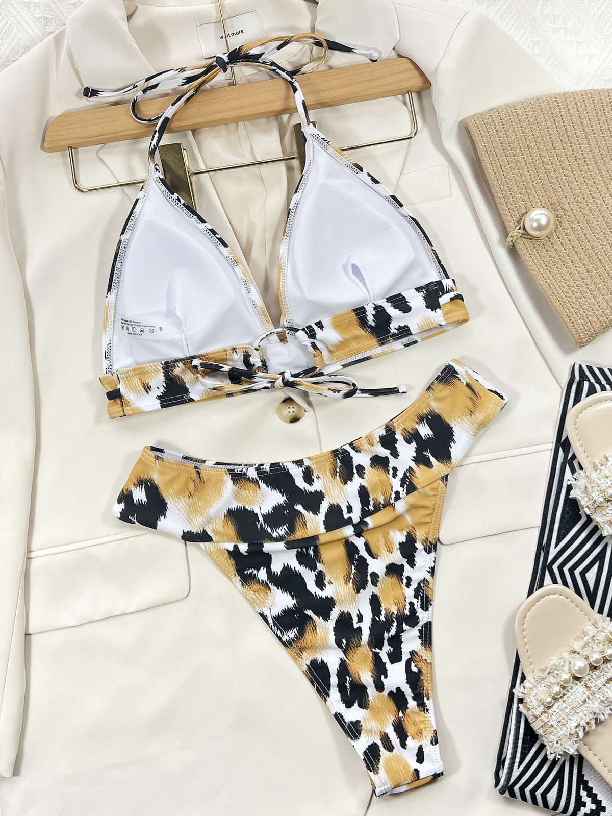 Animal-print bikini laid flat showing white cup lining and matching bottoms
