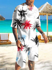 Man wearing white shirt and shorts with black and red palm tree print on a beach