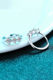 Side and clasp view of an open huggie hoop earring