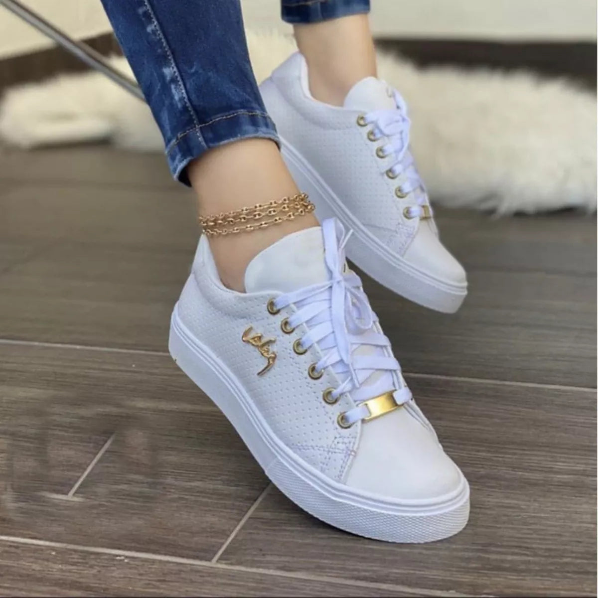 Brown round toe lace-up sneakers with perforated sides and white soles