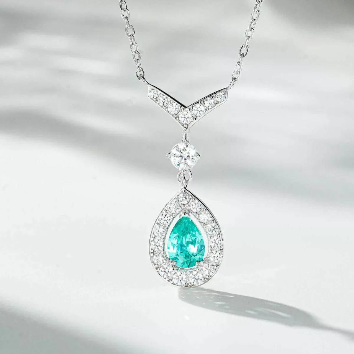 Detail of the necklace pendant with a faceted green stone