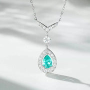 Detail of the necklace pendant with a faceted green stone