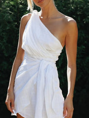 Closer front view of white dress showing gathered shoulder and wrapped waist tie