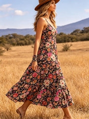 Side view of black floral midi dress with wide flowing skirt