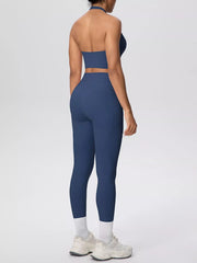 Rear view of blue halter crop top and matching leggings