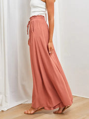 Side view of flowing rose wide-leg pants