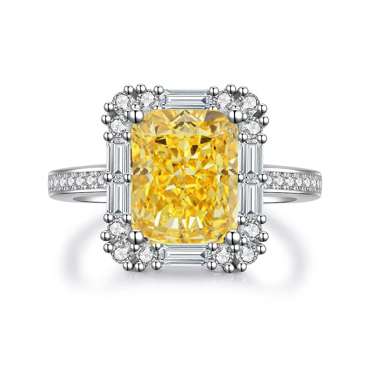 Isolated view of the yellow rectangular center stone and detailed clear-stone setting
