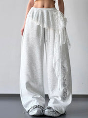 Light gray wide-leg pants styled with a lace overlay