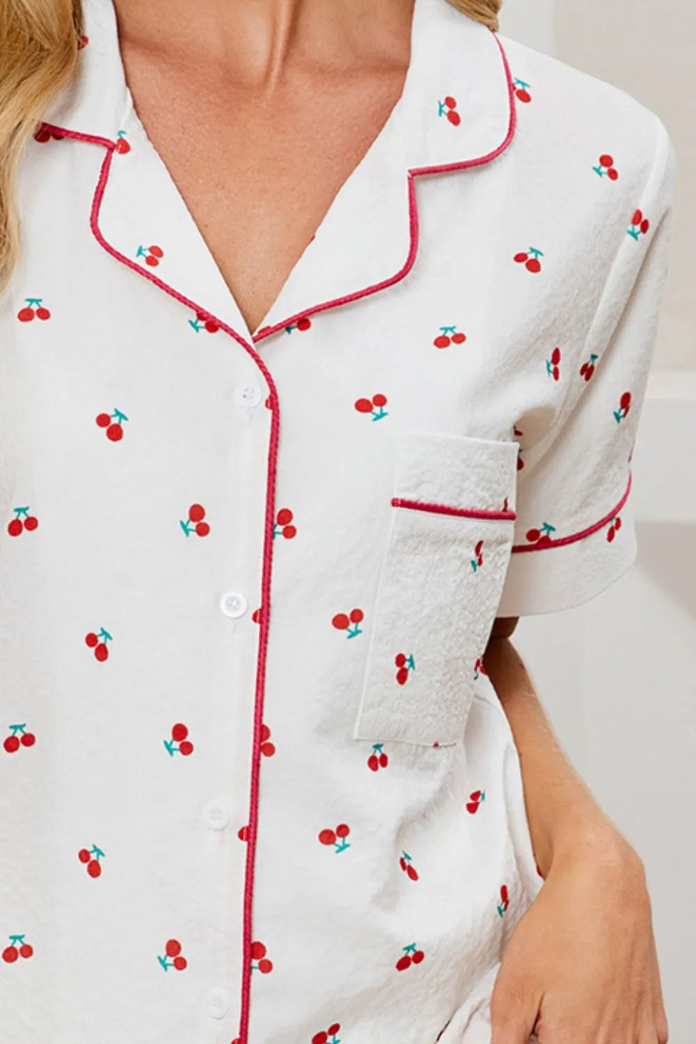 Cherry-Print Collared Top & Shorts Lounge Set: Close-up of cherry-print collared shirt with red piping and buttons.