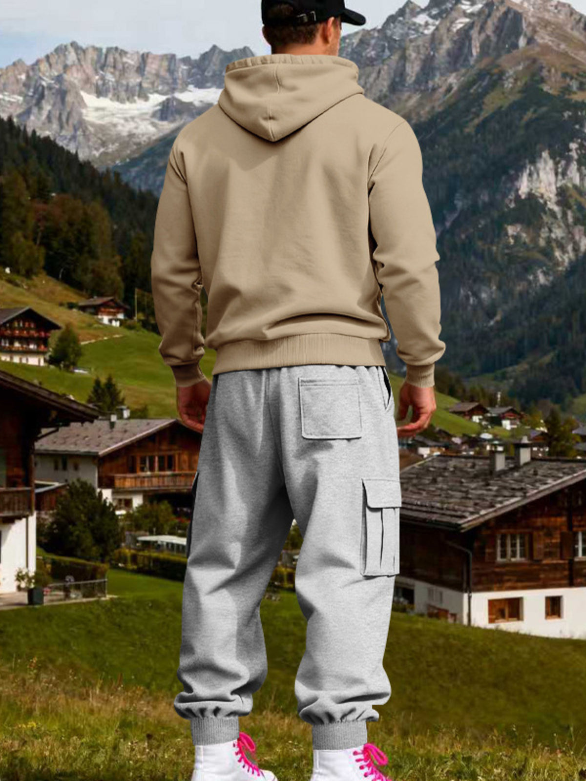 Rear view of beige hoodie and light grey cargo joggers with a square back pocket
