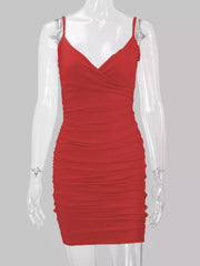 Red spaghetti-strap ruched mini dress displayed front-facing on a mannequin.