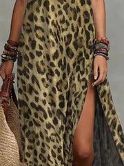 Close-up of the tan leopard-print maxi dress's side slit and loose skirt.